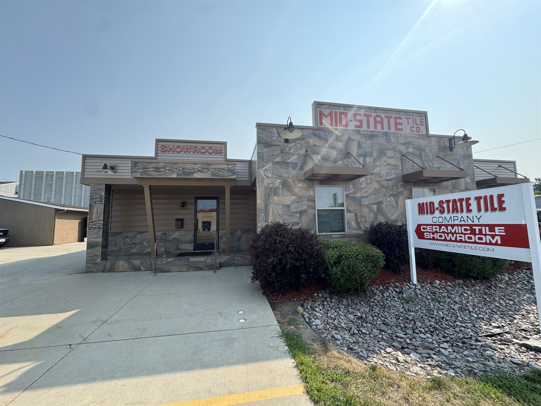 The Mid-State Tile Co. showroom on Lincoln Avenue in St. Cloud, faced in stone look tile, with the Ceramic Tile Showroom sign out front.