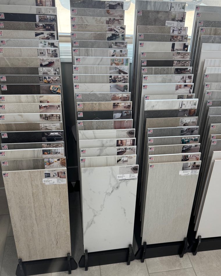 Large format porcelain tile slabs on showroom display racks